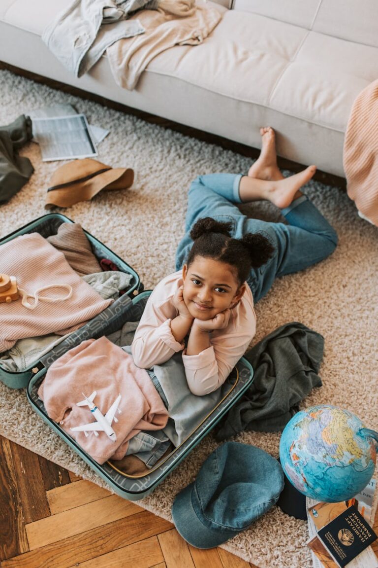 kid lying on a luggage